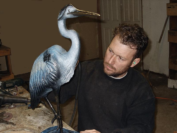 Artisan, Joe Jumalon, creates an accessory to the solid bronze bath tub collection.