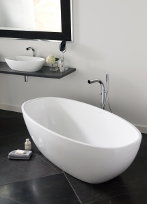 The Victoria + Albert freestanding Barcelona Bath, pebble-shaped, features a rimless, double-ended design that's big enough for two.  Crafted of Englishcast (a composite material with finely ground volcanic limestone), it is cast in one seamless piece and has a glossy white solid surface.